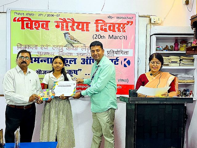 Students receiving certificates from guests on a stage
